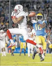  ?? Gina Ferazzi Los Angeles Times ?? STANFORD’S Justin Reid breaks up a long pass intended for Kenny Walker III on UCLA’s final drive.