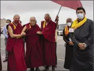  ?? (AP/Tenzin Choejor) ?? Tibetan spiritual leader the Dalai Lama arrives Friday at the airport in Leh, India.