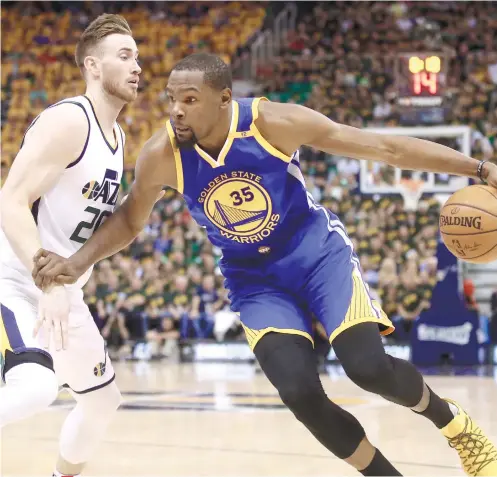  ?? AP FOTO ?? ONE WIN TO GO. Kevin Durant (right) leads the Golden State Warriors in their Game 3 victory over the Utah Jazz. Durant scored 38 and the Warriors are one win away from clinching the series.