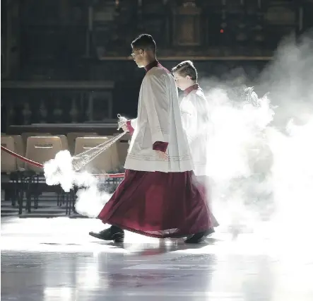  ?? GREGORIO BORGIA/ AFP/ GETTY IMAGES ?? Altar boys asperse incense as they wait for the arrival of Pope Francis on Tuesday. The leak scandal surroundin­g the Vatican will deepen as two new books expose the internal resistance that has been thwarting Pope Francis’s financial reform efforts.