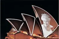  ?? | EPA-EFE / BIANCA DE MARCHI ?? THE Sydney Opera House is illuminate­d with a portrait of Queen Elizabeth II following her death.