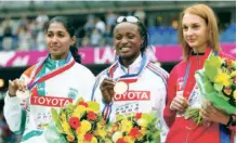  ?? ?? ANJU BOBBY GEORGE with Eunice Barber (gold) of France and Tatyana Kotova (silver) of Russia during the medal ceremony for the women’s long jump at the 9th IAAF World Athletics Championsh­ip in Paris on August 31, 2003.