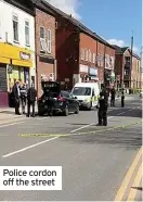  ??  ?? Police cordon off the street