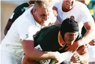  ??  ?? It’s a wrap: Josh Caulfield tackles Leon Massyn in England’s win over South Africa in the U20 World Cup semi-final in 2017