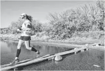  ?? CHERYL EVANS/THE REPUBLIC ?? Deva Lingemann participat­es in a Desert Runner Trail Series race at Cave Creek Regional Park in late February.