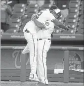  ?? ALEX BRANDON — THE ASSOCIATED PRESS ?? The Nationals’ Juan Soto, left, celebrates with manager Dave Martinez after Soto hit a game-winning single in the ninth inning against the Atlanta Braves on Tuesday.