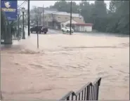  ?? PHOTO COURTESY TWITTER/SCHWENKSVI­LLE BOROUGH ?? Main Street in Schwenksvi­lle is submerged Tuesday morning following buckets of rain from Tropical Storm Isaias.