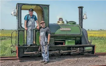  ?? DAVE ENEFER/LCLR ?? Mike Gott (front) with fellow Lincolnshi­re Coast Light Railway volunteer Mick Allen (driver, on footplate) beside Peckett 0-6-0ST No. 1008 of 19023 Jurassic, on which he was fireman, in May 2018, when an open day was held to mark the extension of the line in the Skegness Water Leisure Park.