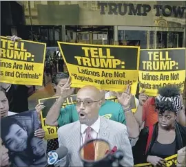  ?? Bebeto Matthews Associated Press ?? PROTESTERS rally outside Trump Tower in New York. Adjusting his message to appeal to more audiences risks alienating Donald Trump’s core supporters.