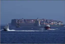  ?? DAMIAN DOVARGANES — THE ASSOCIATED PRESS ?? Heavy maritime traffic in front of the MSC DANIT ship, left, anchored outside the Port of Los Angeles.