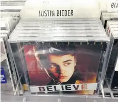  ?? Dd e r r i k J. L a ng / t h e ass o c i at e p r e ss ?? Bogus albums of Justin Bieber’s Believe that were placed in L.A. box stores actually contained a copy of Paz’s CD.