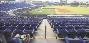  ?? Alfredo Zuniga / Associated Press ?? A man watches a profession­al baseball game between Boer de Managua and Flecheros de Matagalpa at Dennis Martinez National Stadium in Managua, Nicaragua, on April 25. As the coronaviru­s spread and economies shut across Latin America, Nicaragua stayed open: schools, stores, concert halls, and baseball stadiums, all operating uninterrup­ted on orders of a government that denied the gravity of the disease.