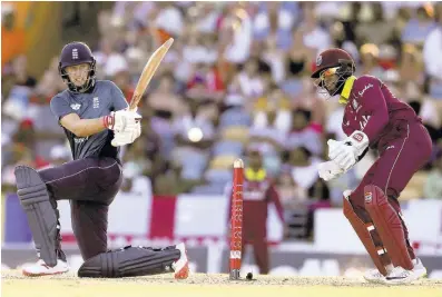  ?? FILE ?? England’s Joe Root plays a shot against West Indies during the first One Day Internatio­nal match at the Kensington Oval in Bridgetown, Barbados, Wednesday, February 20, 2019.