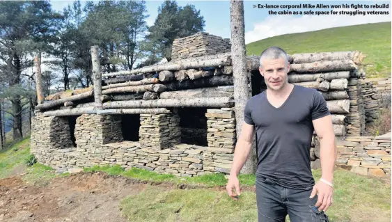  ??  ?? > Ex-lance corporal Mike Allen won his fight to rebuild the cabin as a safe space for struggling veterans