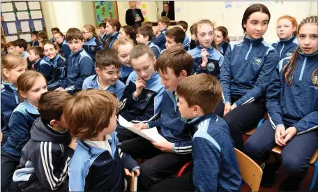  ??  ?? Diarmuid O’Sullivan reading his Mother Joanne O’Sullivan letter from the Capsule to classmates at the opening of the 2020 Vision Porject Capsule at Knockaderr­y National School, Farranfore on Friday.Photo by Michelle Cooper Galvin