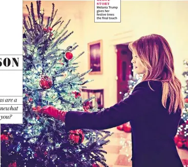  ??  ?? GLOVE STORY Melania Trump gives her festive trees the final touch