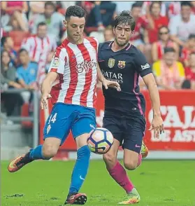  ?? FOTO: MANEL MONTILLA ?? Sergi Roberto sale al paso de Burgui Brilló en defensa y en ataque