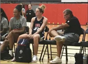  ?? DOUG FEINBERG — THE ASSOCIATED PRESS ?? Connecticu­t head coach Geno Auriemma, from right, Katie Lou Samuelson, Azura Stevens and other players attend the Under-23USA Basketball training camp in Colorado Springs, Colo., Tuesday.