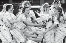  ?? Jason Fochtman / Staff photograph­er ?? Barbers Hill’s softball team huddles after defeating Aledo 4-1 to win the Class 5A state crown in June.