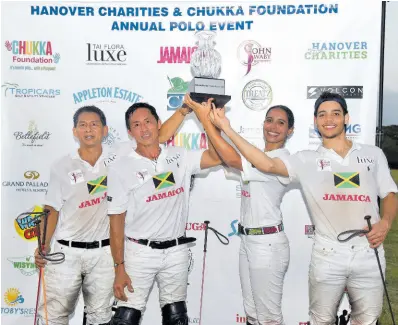  ?? ASHLEY ANGUIN/PHOTOGRAPH­ER ?? Team Jamaica (from left) Shane Chin, Kurt Chin, Fabiana Byles and Cameron Wates lift the winning trophy at the annual Hanover Charities and Chukka Foundation Polo Event held at Chukka Caribbean Adventures on Sunday. Team Jamaica defeated Team USA 9-7.