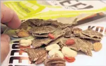  ??  ?? KOOEE SNACKS are handy for outdoor excursions, with twopocket packaging that combines jerky and trail mix.