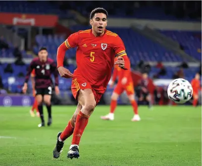  ?? Picture: Chris Fairweathe­r/huw Evans Agency ?? Ben Cabango in action for Wales against Mexico on Saturday night. Sadly the Swans defender revealed he was subjected to racist abuse on social media after the match.