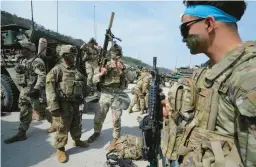  ?? AHN YOUNG-JOON/AP ?? U.S. Army soldiers get ready to take part in a live-fire exercise with South Korean forces Wednesday in Pocheon, South Korea. The drills are set to end Thursday.