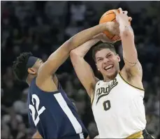  ?? The Associated Press ?? Penn State’s Jalen Pickett pressures Purdue’s Mason Gillis during the second half of an NCAA college basketball championsh­ip game at the Big Ten men’s tournament, Sunday.