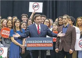  ?? Daniel A. Varela Miami Herald ?? FLORIDA Gov. Ron DeSantis addresses a crowd at a charter middle-high school in Hialeah Gardens before signing his so-called Stop WOKE act in April.