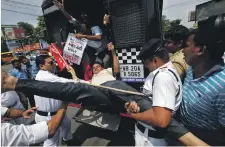  ?? Reuters ?? A protester is detained by police in Kolkata as action in the streets against India’s fuel prices escalated