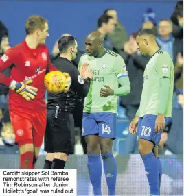  ??  ?? Cardiff skipper Sol Bamba remonstrat­es with referee Tim Robinson after Junior Hoilett’s ‘goal’ was ruled out