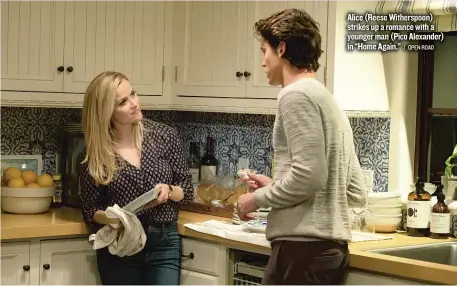  ??  ?? Alice ( Reese Witherspoo­n) strikes up a romance with a younger man ( Pico Alexander) in “Home Again.”
| OPEN ROAD