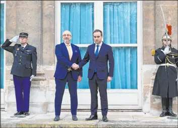  ?? Julie Sebadelha The Associated Press ?? Ukrainian Minister of Defense Oleksii Reznikov, center left, and French Defense Minister Sebastien Lecornu, center right, during Reznikov’s visit to Paris on Tuesday.