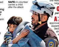  ??  ?? SAFE: A volunteer carries a child after the attack