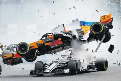  ??  ?? JUMPIN’ JACK FLASH. Francois Lenoir, from Belgium, captured this image of McLaren’s Fernando Alonso and Sauber’s Charles Leclerc crashing at the first corner during the Belgian Grand Prix in Spa-Francorcha­mps, Belgium last year. The image has been shortliste­d in the Open, Motion category.