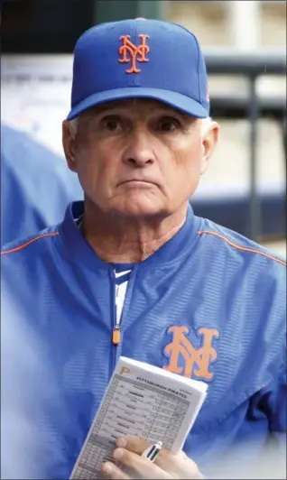  ?? KATHY WILLENS — ASSOCIATED PRESS ?? New York Mets manager Terry Collins had little reason to smile as walks in the dugout during Sunday's 11-1 lost to the Pirates at Citi Field.