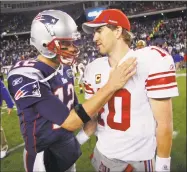 ?? Associated Press file photo ?? Eli Manning, right, is congratula­ted by Tom Brady after a game in Foxborough, Mass.