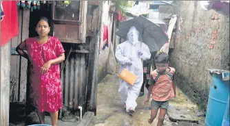  ??  ?? A BMC health worker visits Kranti Nagar in Kurla to screen residents, on Wednesday.