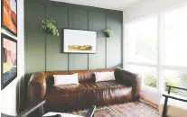  ?? VINTAGE REVIVALS ?? Sherwin-williams Rosemary SW 6187 provides a calming green background to this living room.