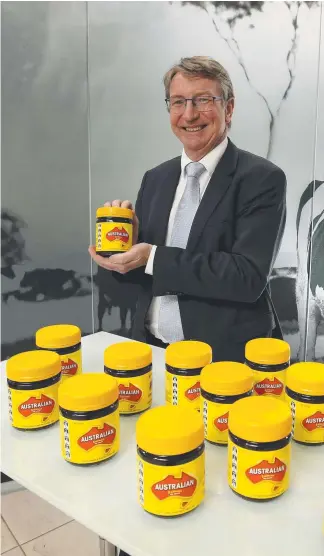  ?? Picture: STUART McEVOY ?? Bega chairman Barry Irvin with Australian labelled Vegemite jars in Melbourne after the company acquired the iconic Aussie spread brand.