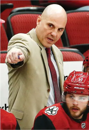  ?? ROSS D. FRANKLIN/THE ASSOCIATED PRESS ?? Arizona Coyotes head coach Rick Tocchet has a “unique relationsh­ip” with hockey analyst Dave Poulin after the two were roommates in the 1980s as members of the Philadelph­ia Flyers. But with the current collective bargaining agreement, only entry-level players have roomies on the road.