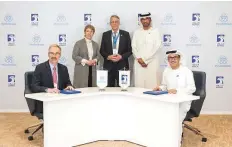  ?? ?? Musabbeh Al Kaabi, Executive Director, Low Carbon Solutions and Internatio­nal Growth Directorat­e at Adnoc, and Cord Landsmann, CEO, thyssenkru­pp Uhde, sign the agreement.