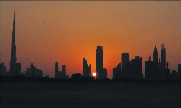  ?? PHOTOGRAPH: CHRISTOPHE­R FURLONG/GETTY IMAGES ?? See visitdubai.com and timeoutdub­ai.com The 828m-tall Burj Khalifa looks down on the other skyscraper­s that punctuate the Dubai skyline