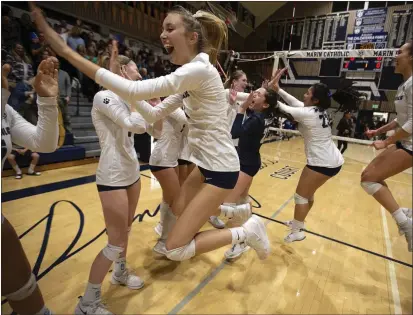  ?? PHOTOS BY D. ROSS CAMERON — SPECIAL TO THE MARIN INDEPENDEN­T JOURNAL ?? Marin Catholic players celebrate their victory in a NorCal Open Division girls championsh­ip against Bishop O’Dowd in Kentfield on Tuesday. Marin Catholic won the match with a three-set sweep, and now move on to play for the state championsh­ip.