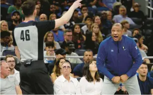  ?? KEVIN KOLCZYNSKI/AP ?? Philadelph­ia 76ers head coach Doc Rivers, right, yells at official Ben Taylor during a game against the Orlando Magic on Friday.