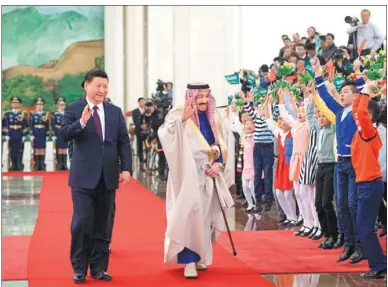  ?? LI XUEREN / XINHUA ?? President Xi Jinping holds a welcoming ceremony for visiting Saudi Arabian King Salman bin Abdulaziz al-Saud at the Great Hall of the People in Beijing on Thursday.