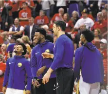  ??  ?? The bench reacts after a scoring play in the second half of the Warriors’ Game 1 victory over the Rockets at Toyota Center.