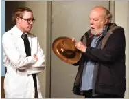  ??  ?? Dr. Chumley, played by Ralph Bourne, right, points out the hat holes are for Harvey as Dr. Sanderson, played by Connor Nielsen listens during the rehearsal of “Harvey” begins April 6 and runs through April 21 at Barn Theater in Portervill­e.