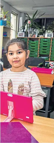  ?? Picture: Steve Brown. ?? Esolperth is supplying laptops and tablets to Fair City folk affected by “digital poverty”, including Alena Georgieva, 7, and Irina Georgieva, who are pictured with the organisati­on’s Linda El-miligy.