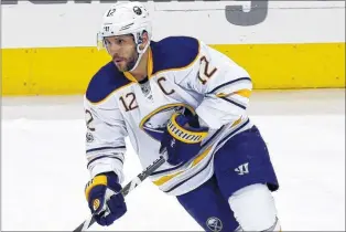  ?? ASSOCIATED PRESS FILE PHOTO/PAUL VERNON ?? This March 28, 2017, file photo shows Buffalo Sabres forward Brian Gionta carrying the puck during an NHL against the Blue Jackets in Columbus, Ohio. The 38-year-old Gionta has no regrets about the decision he made to forego a chance at playing a 17th...